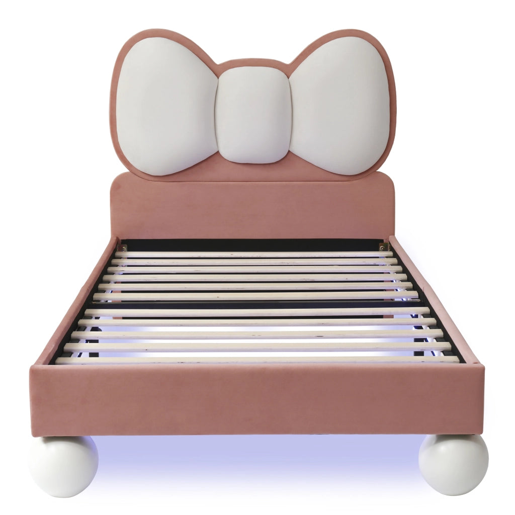 Letto singolo 90x200 cm in velluto rosa con testiera a fiocco e LED