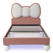 Letto singolo 90x200 cm in velluto rosa con testiera a fiocco e LED