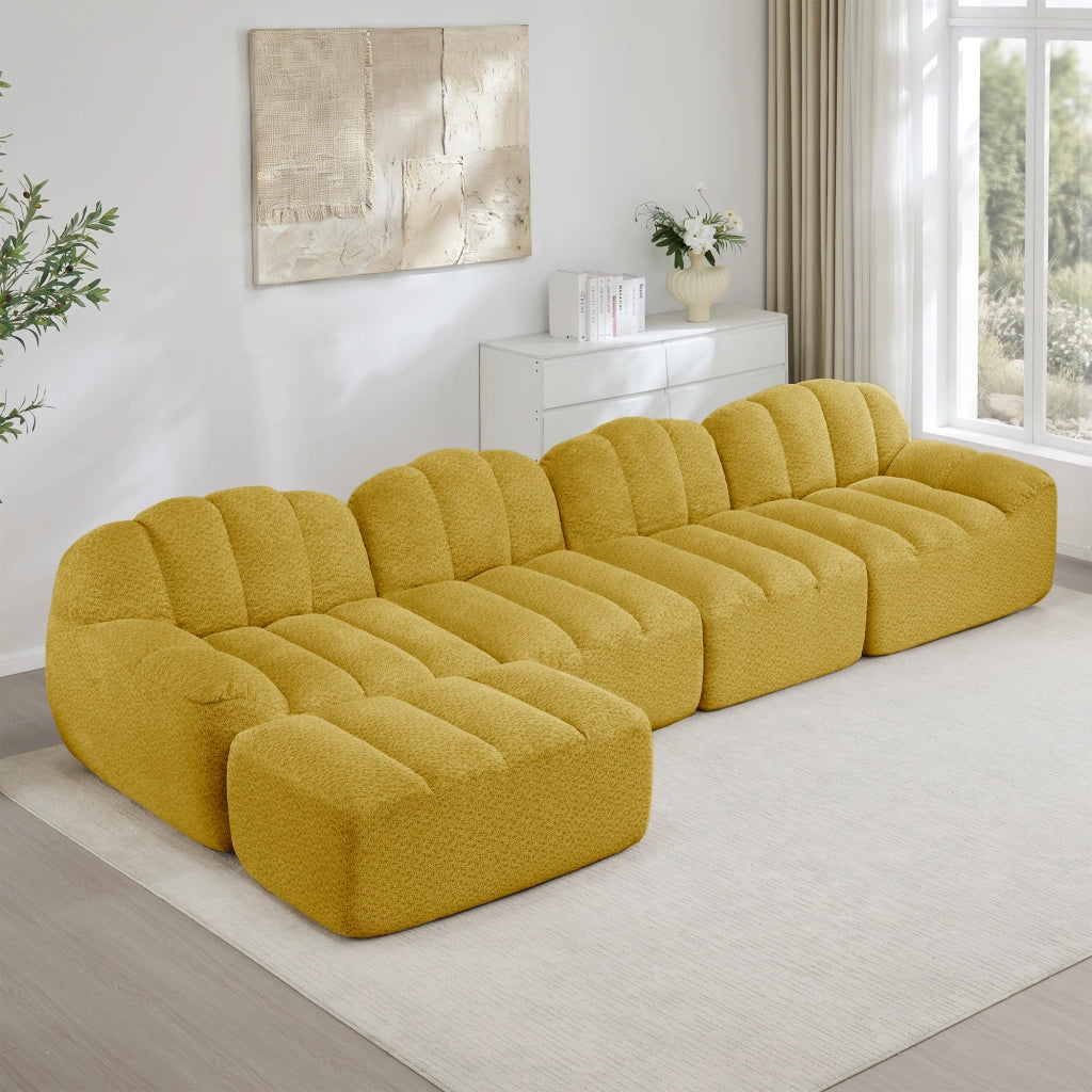 Divano modulare angolare 4 posti con ottomana, seduta profonda e braccioli ergonomici in pile granulato giallo