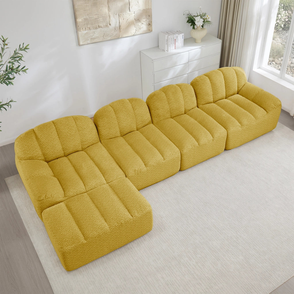Divano modulare angolare 4 posti con ottomana, seduta profonda e braccioli ergonomici in pile granulato giallo