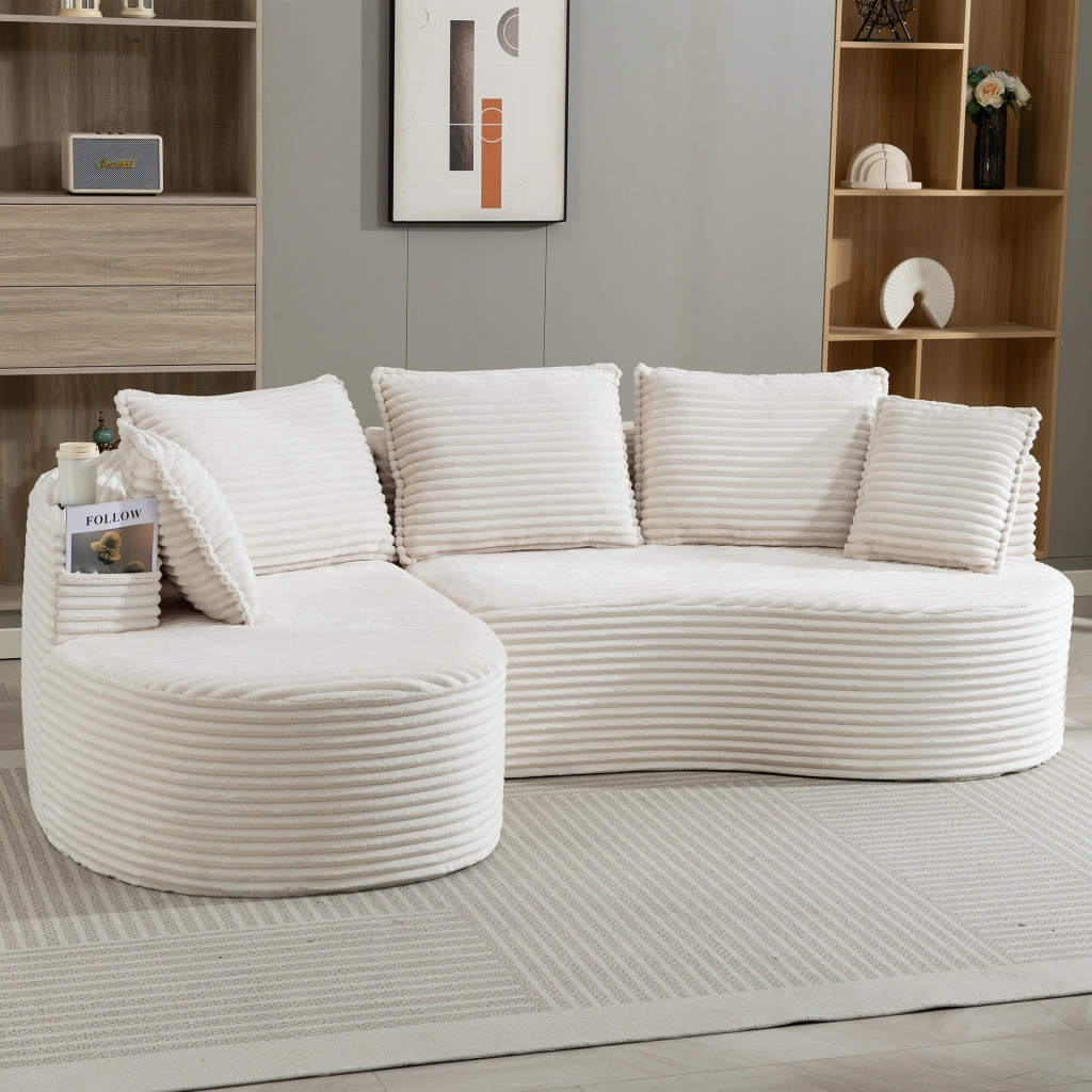 Divano curvo 250x152x82 cm con portabevande e tasche laterali; velluto a coste beige; con cuscino