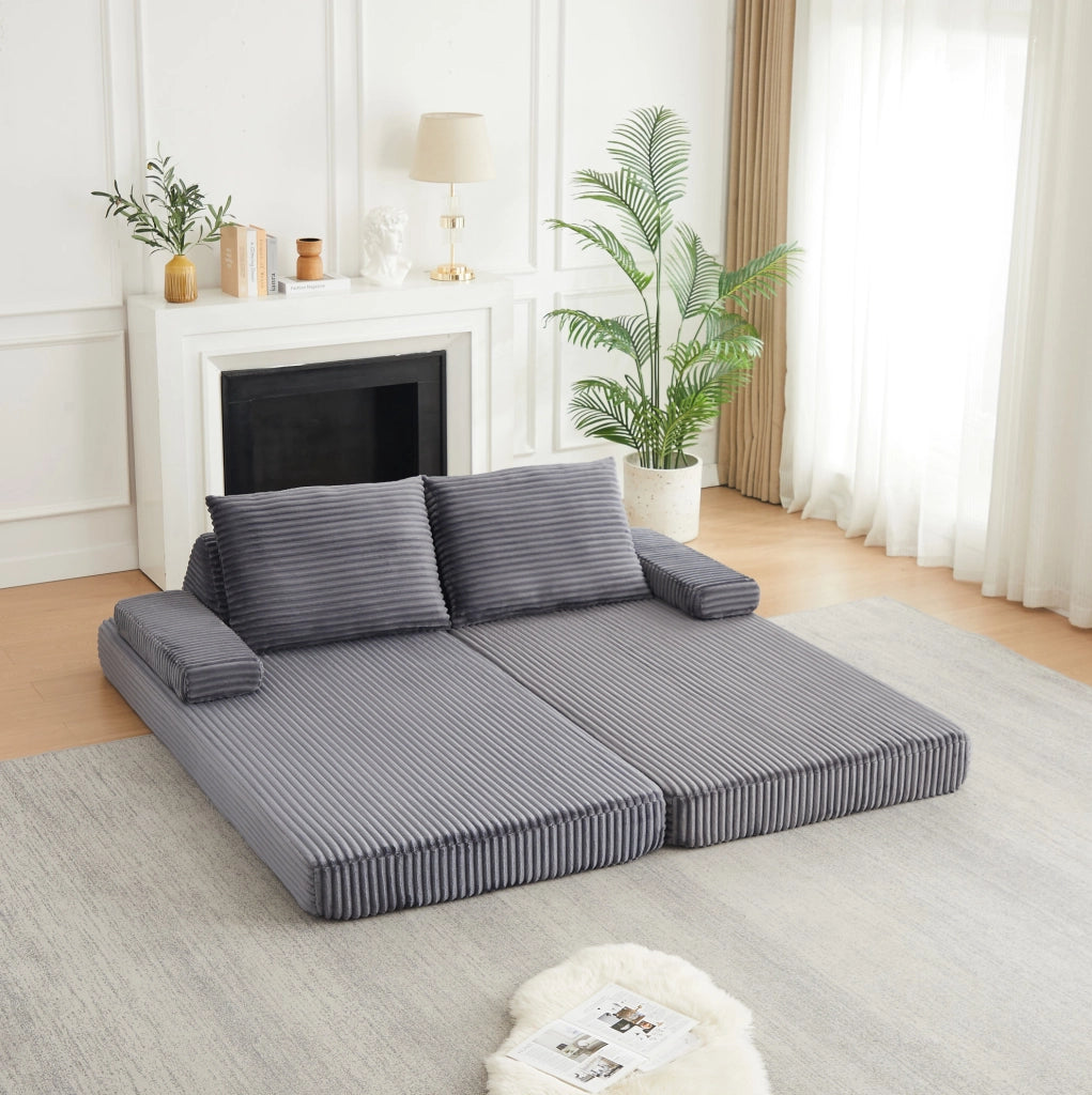 Divano modulare in velluto a coste grigio con schienali mobili e configurazioni flessibili