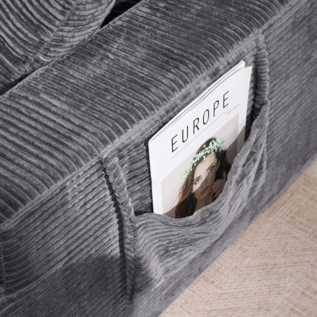 Divano da relax in tessuto a coste grigio scuro con tasche laterali HOMVRA