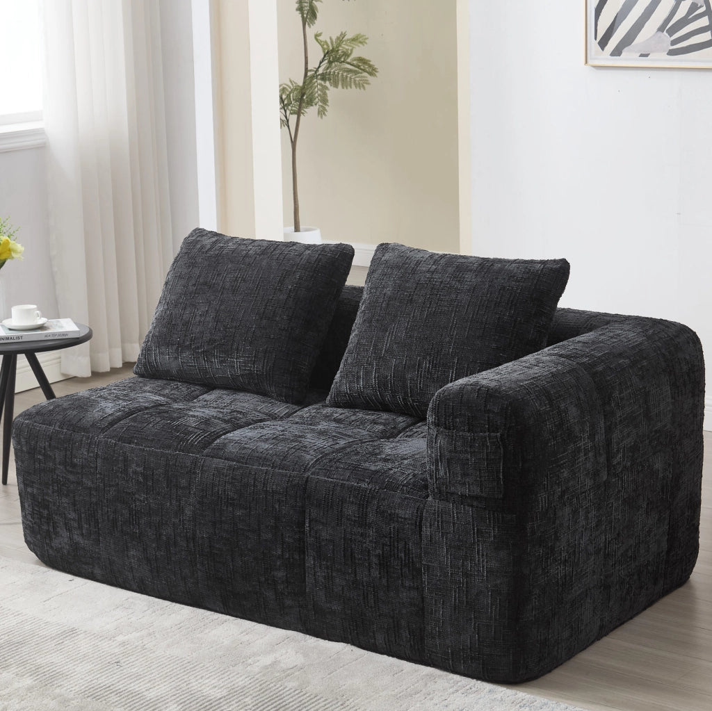 Divano comodo per 2 persone con chaise longue, tessuto chenille nero, cuscino incluso e tasche laterali per telecomando e cellulare