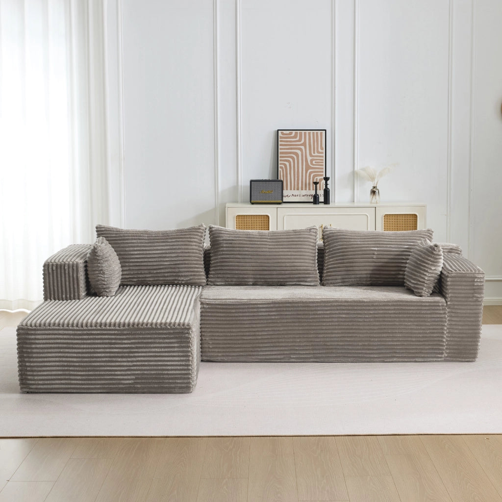Divano angolare modulare con chaise longue e seduta profonda, senza montaggio, in velluto a coste grigio