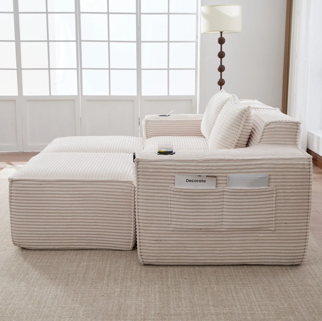 Divano modulare in velluto a coste beige con portabevande e tasche