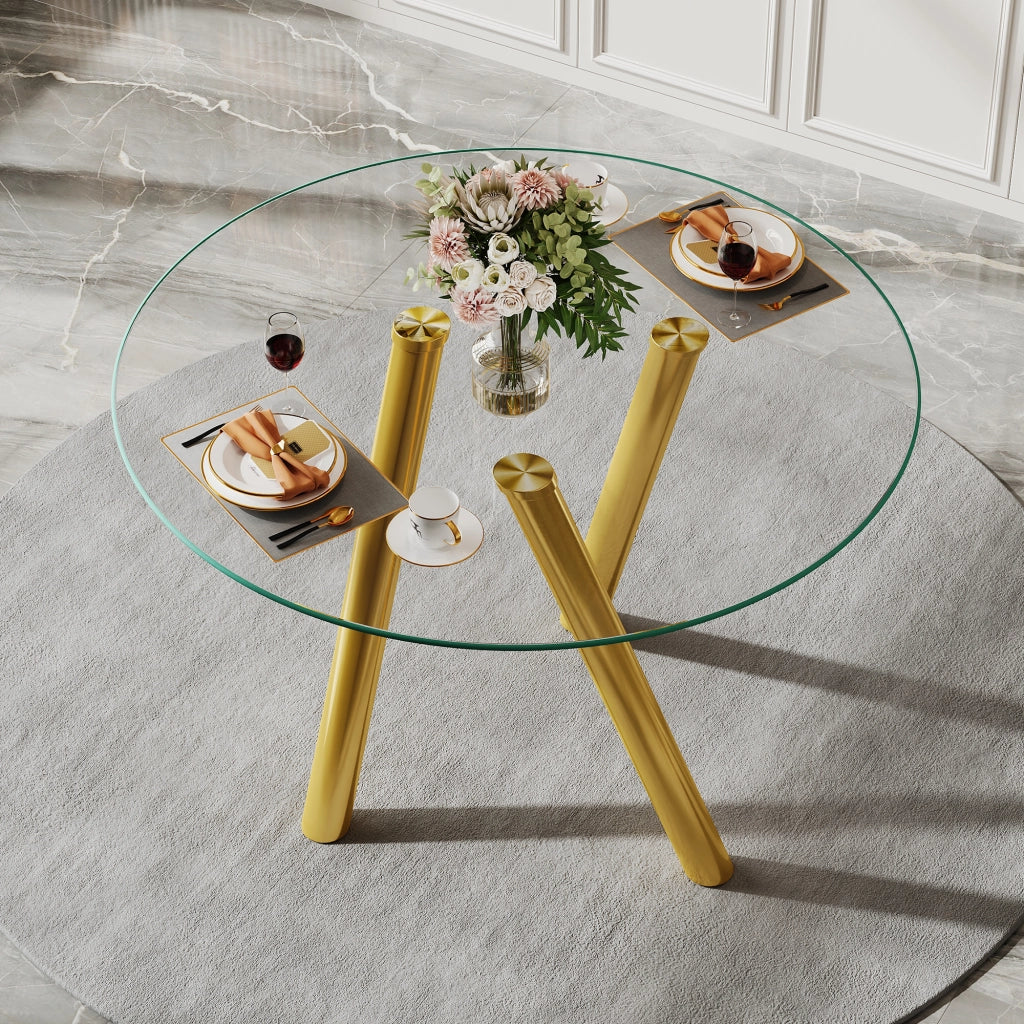 Tavolo da pranzo rotondo in vetro temperato con gambe in metallo color oro design per sala da pranzo