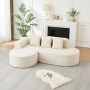 Divano modulare a L beige in velluto a coste con forme curve
