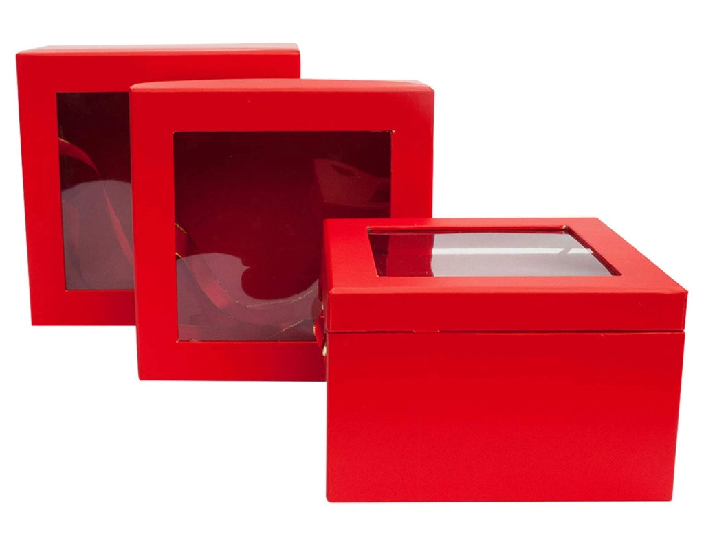 Set di tre scatole regalo quadrate, rosse, con parte superiore trasparente e nastri di raso