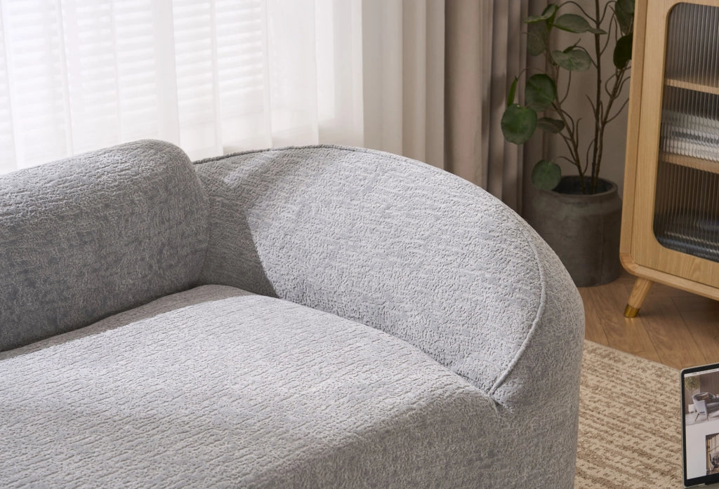 Divano chaise longue in ciniglia grigio chiaro con cuscino