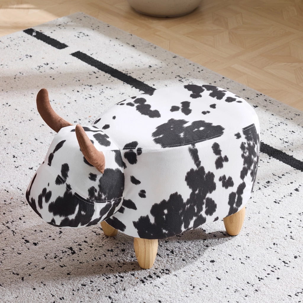 Sgabello a forma di mucca 62x35x36 cm; poggiapiedi e seduta per bambini; gambe in legno; nero e bianco