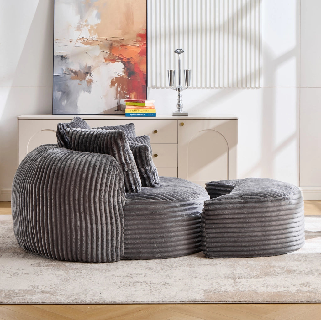 Poltrona lounge rotonda in velluto a coste grigio scuro con pouf e 5 cuscini