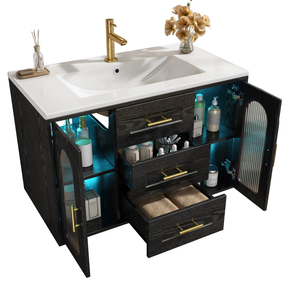 Mobile bagno sospeso 76 cm con lavabo in ceramica, finitura effetto legno nero, ante in vetro scanalato, illuminazione LED integrata
