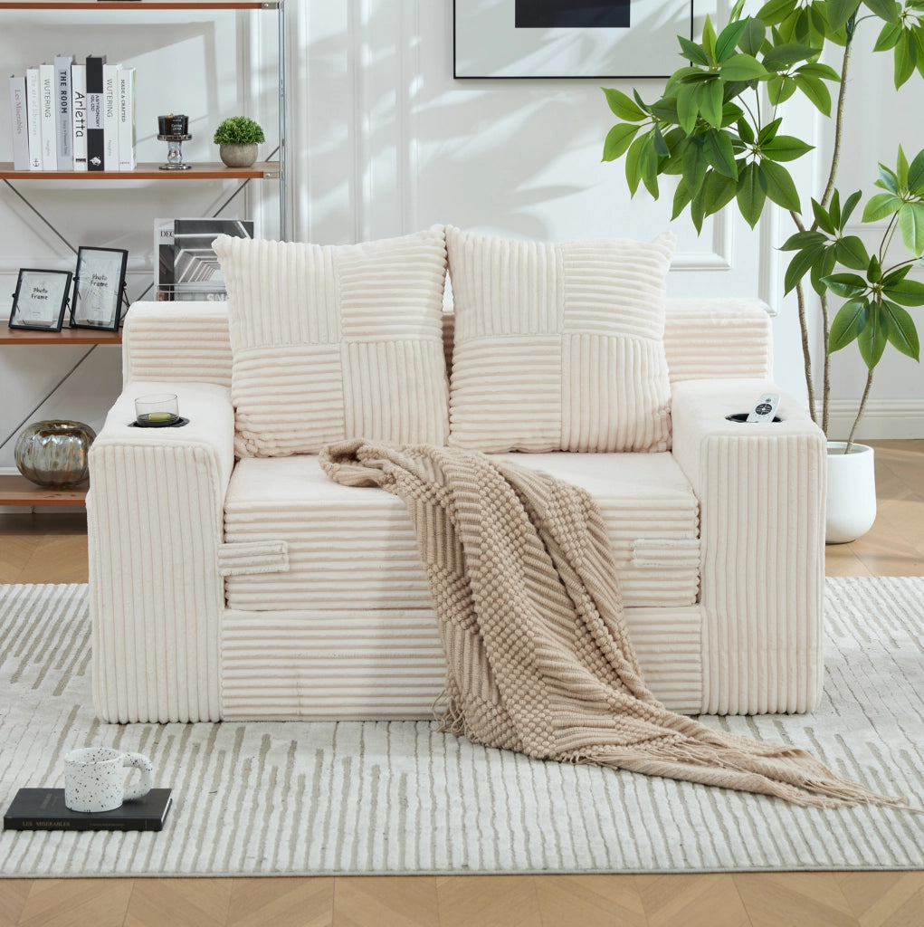 Divano in velluto a coste beige con tasche laterali e due cuscini