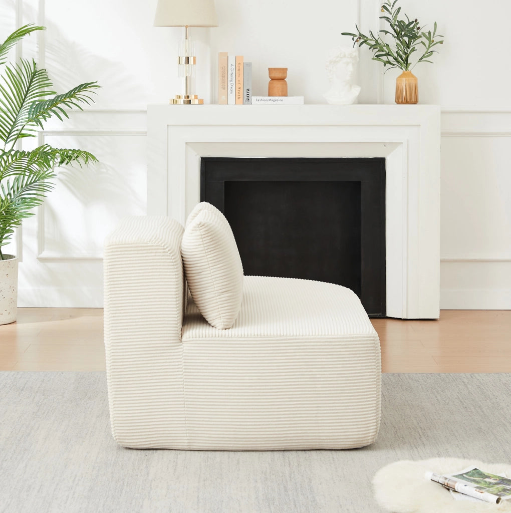 Divano modulare a L beige in velluto a coste con forme curve