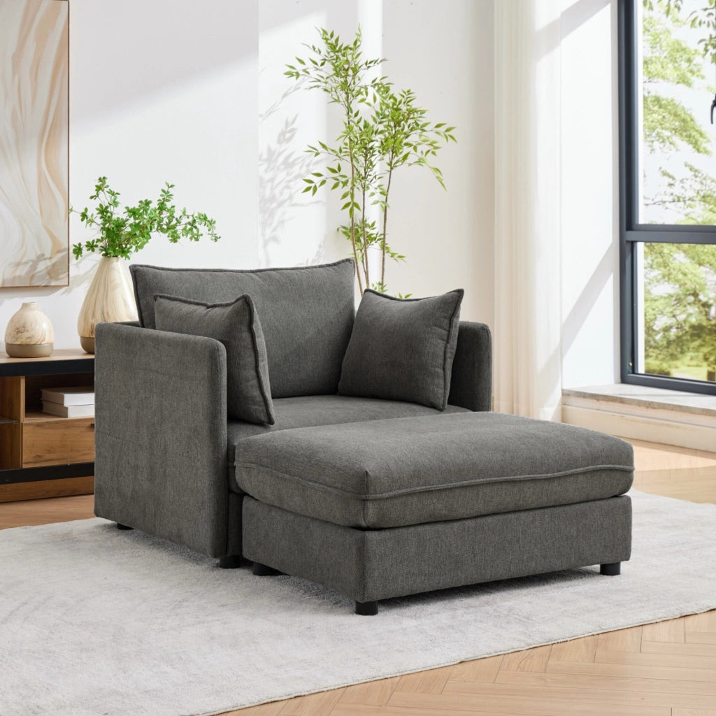 Poltrona in velluto Altay grigio con pouf contenitore e struttura in legno massello