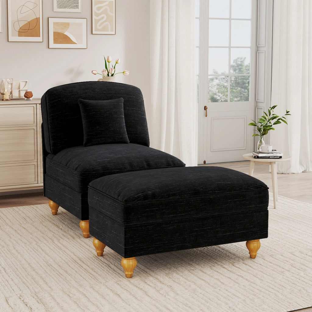 Poltrona in ciniglia nera con pouf mobile; gonne con volant rimovibili; schienale segmentato e cuscino di supporto