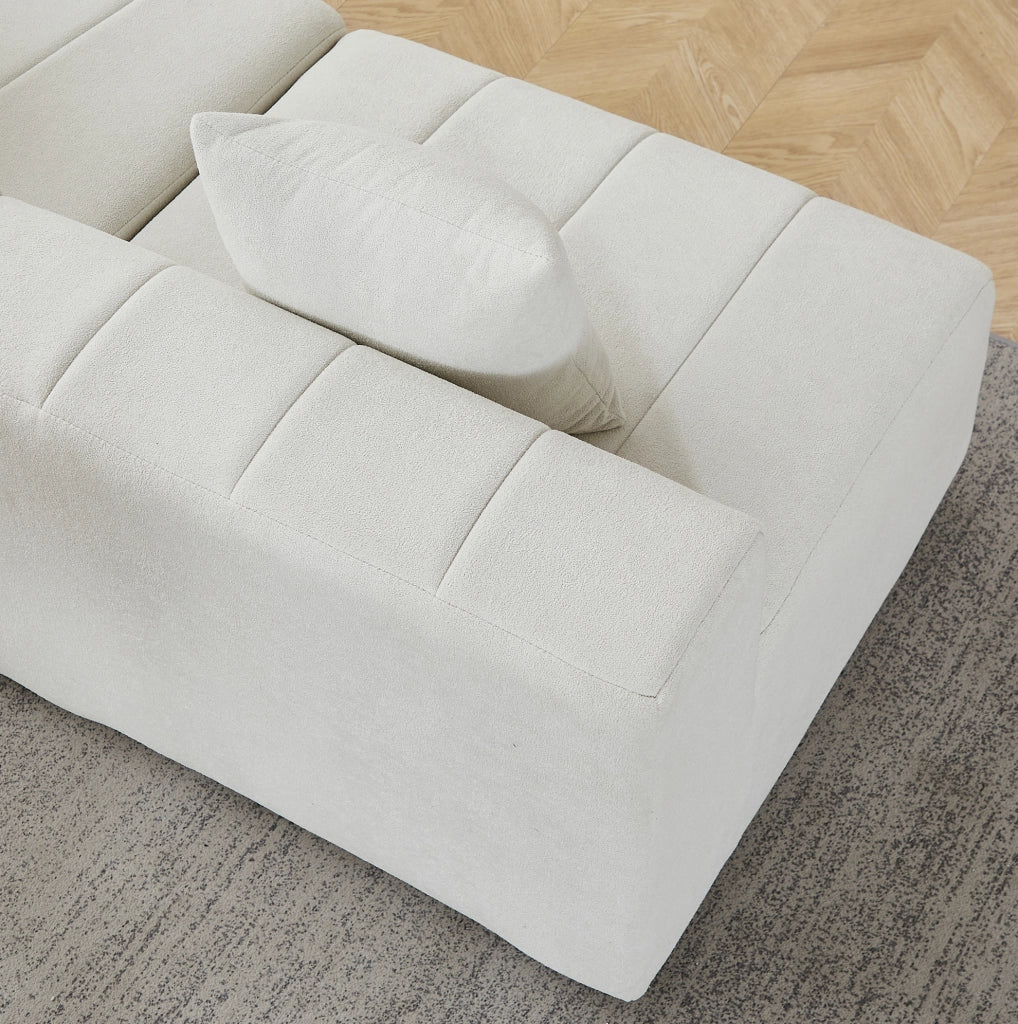 Modulo divano curvo beige in ciniglia con due cuscini