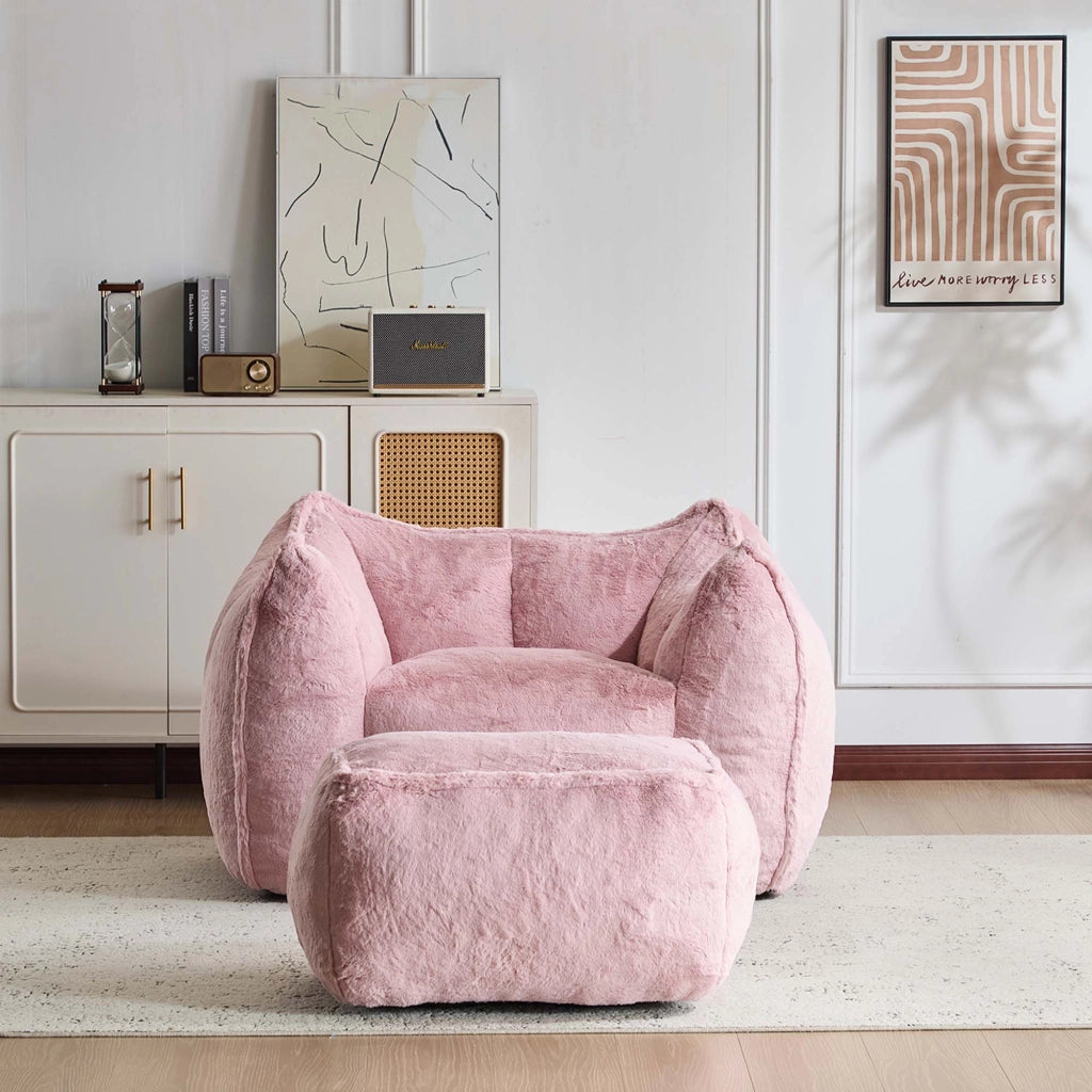 Poltrona con pouf; imbottitura in schiuma e rivestimento in pelliccia sintetica rosa