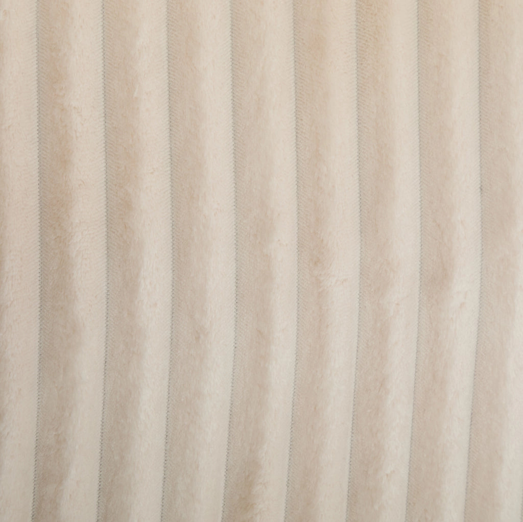 Poltrona rotonda in velluto a coste beige con poggiapiedi e 5 cuscini