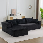 Divano modulare a L in due elementi; con chaise longue e seduta profonda; in velluto a coste nero
