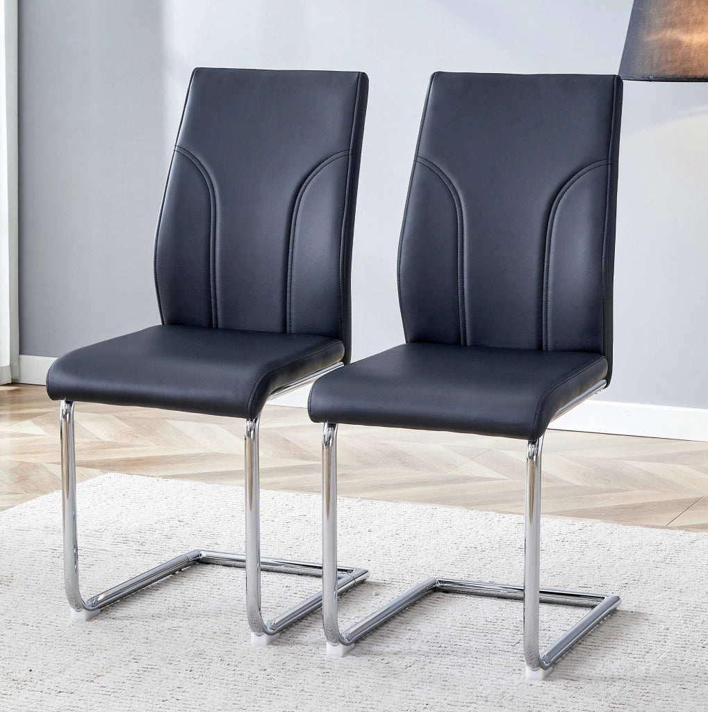 Sedie con rivestimento nero in similpelle e gambe argentate