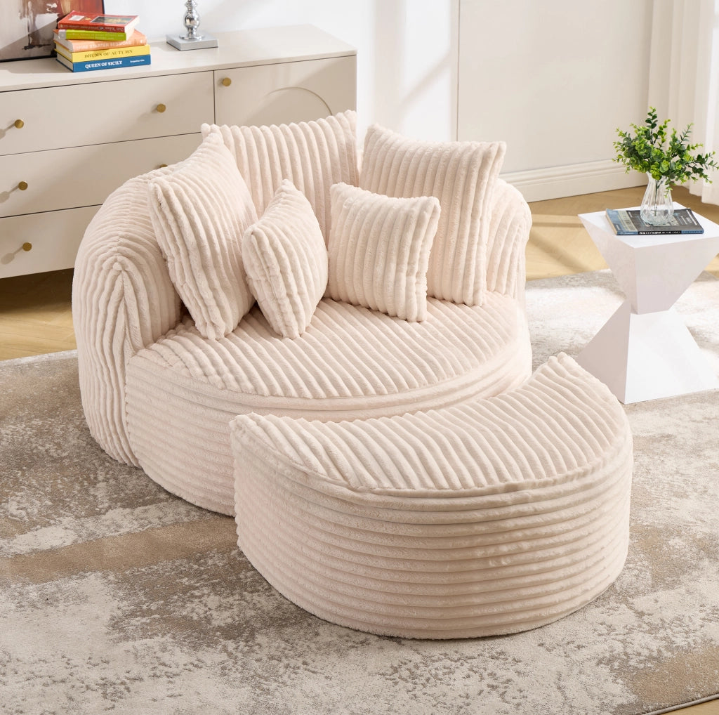 Poltrona rotonda in velluto a coste beige con poggiapiedi e 5 cuscini