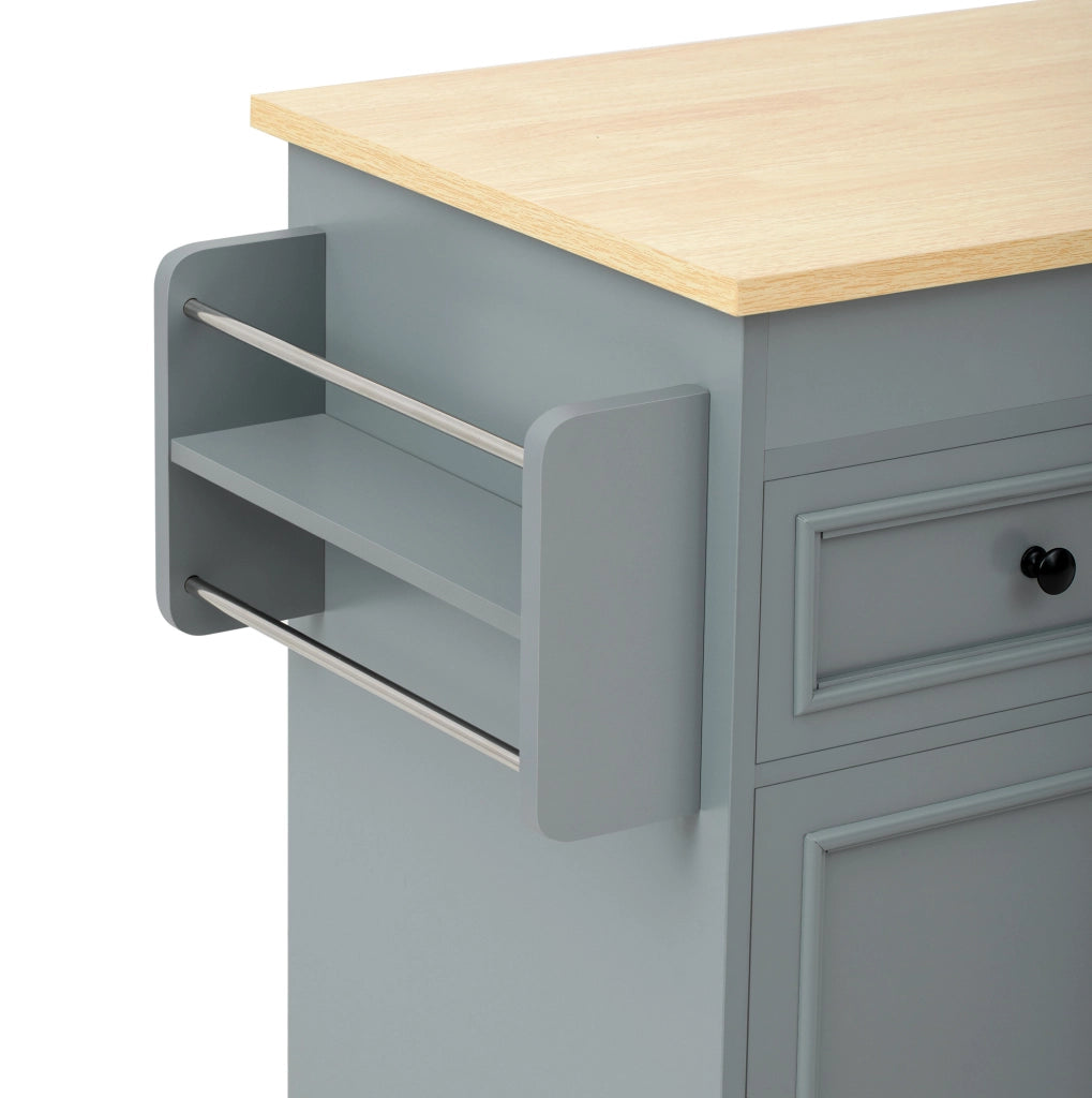 Isola cucina mobile grigia con piano estraibile e cassetti
