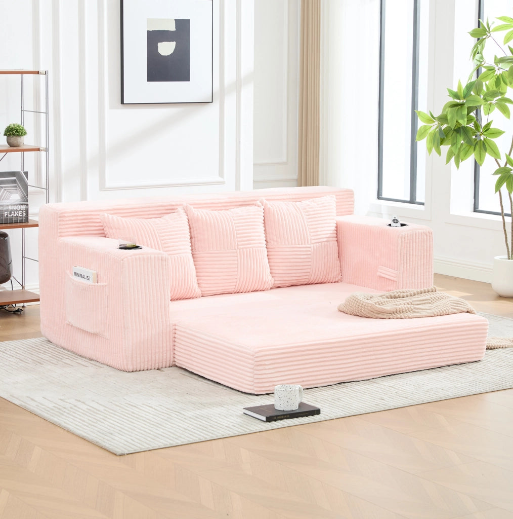 Divano modulare rosa in velluto a coste con portabicchieri