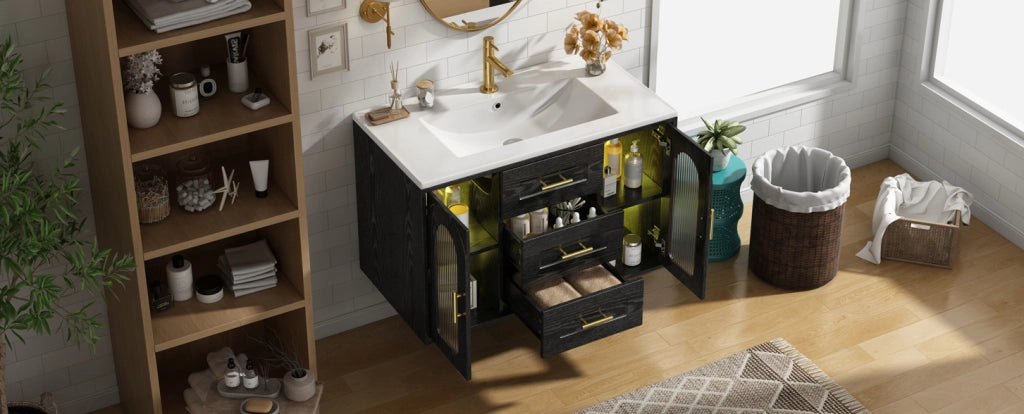 Mobile bagno sospeso 76 cm con lavabo in ceramica, finitura effetto legno nero, ante in vetro scanalato, illuminazione LED integrata