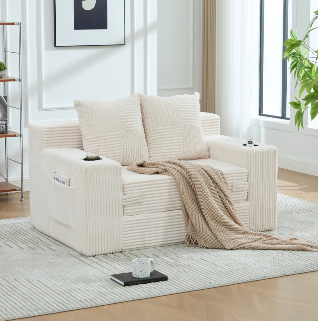 Divano in velluto a coste beige con tasche laterali e due cuscini