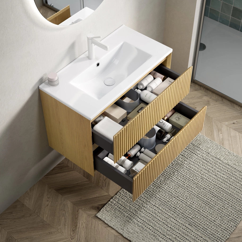 Mobile bagno sospeso 75 cm con lavabo integrato in ceramica; 2 cassetti con chiusura ammortizzata; rovere dorato e bianco