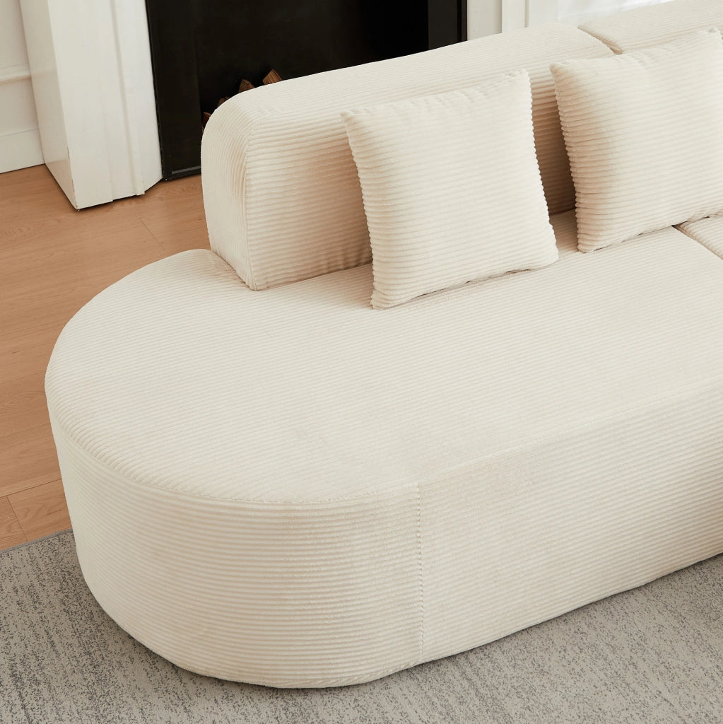 Divano modulare a L beige in velluto a coste con forme curve