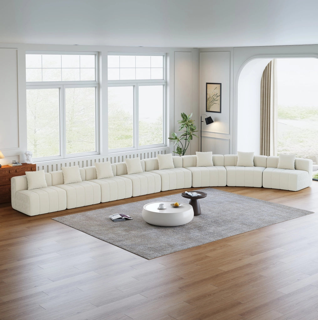 Modulo divano curvo beige in ciniglia con due cuscini