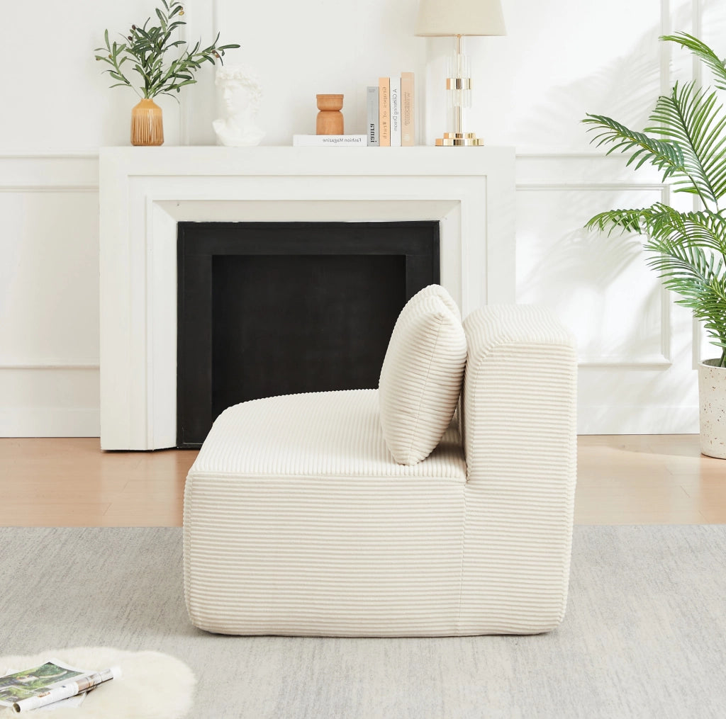 Divano modulare a L beige in velluto a coste con forme curve
