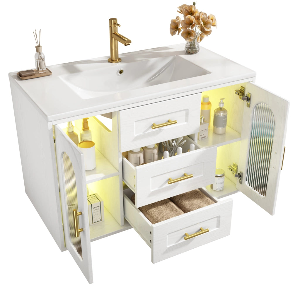 Mobile bagno sospeso 76 cm con lavabo in ceramica, finitura effetto legno bianco, anta in vetro scanalato, illuminazione LED integrata, ripiani regolabili