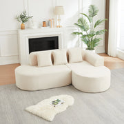 Divano modulare a L beige in velluto a coste con forme curve