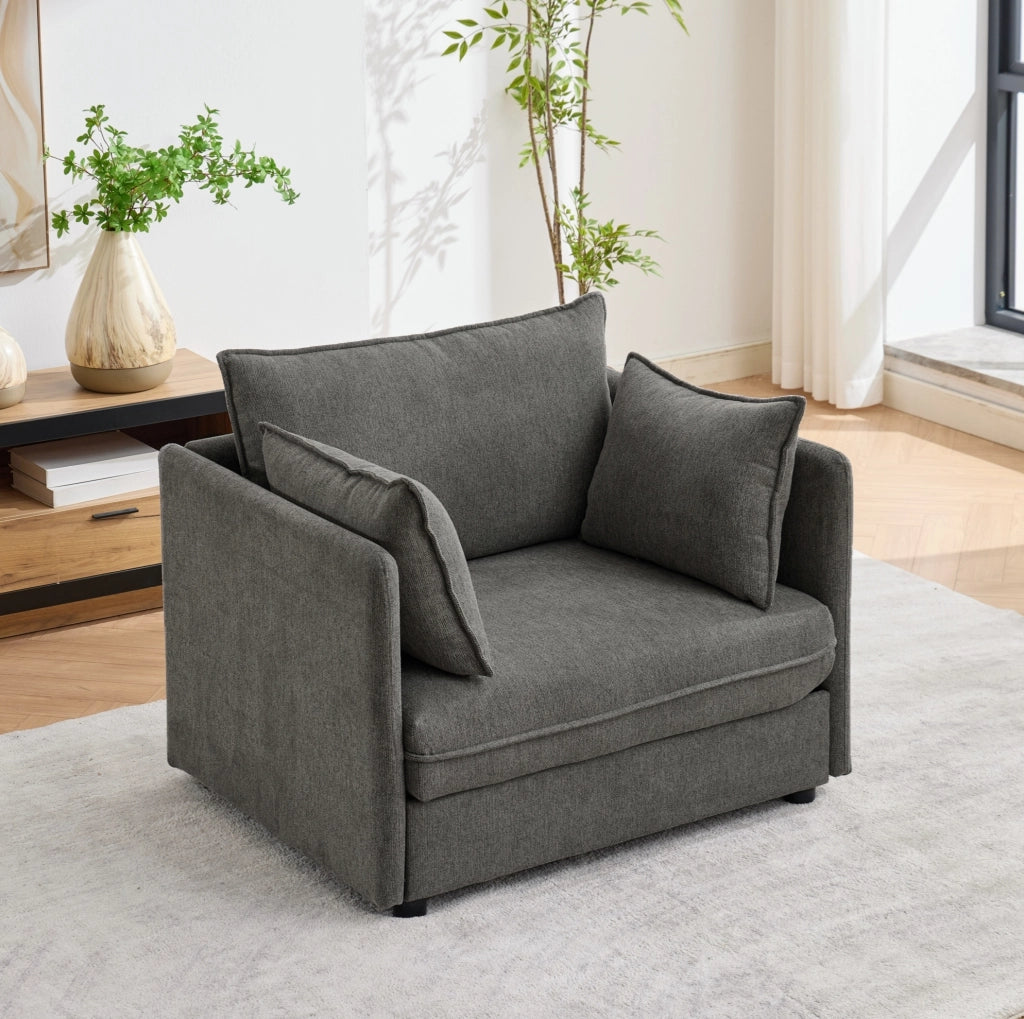 Poltrona in velluto Altay grigio con pouf contenitore e struttura in legno massello