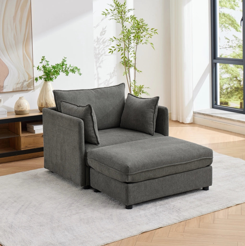 Poltrona in velluto Altay grigio con pouf contenitore e struttura in legno massello