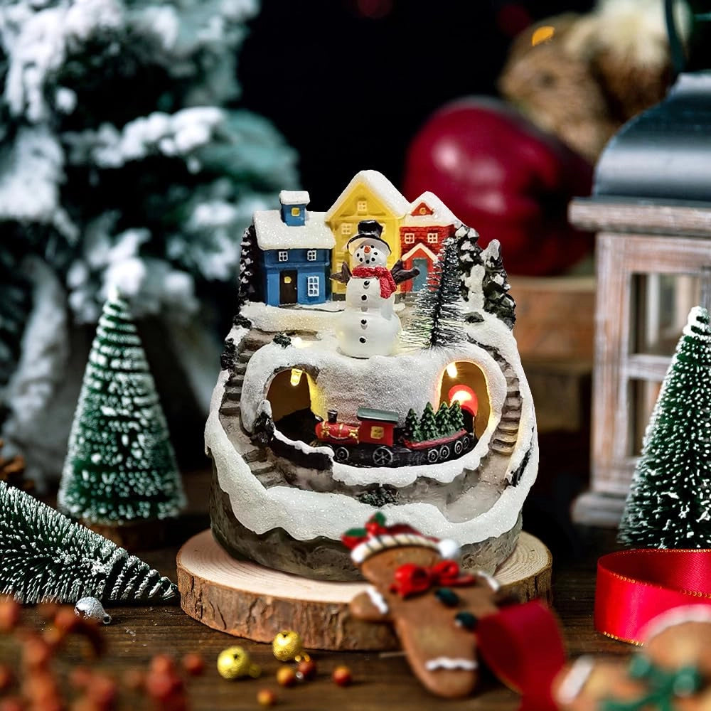 Villaggio natalizio illuminato, con musica e trenino, realizzato in resina, dimensioni 12x12x14 cm