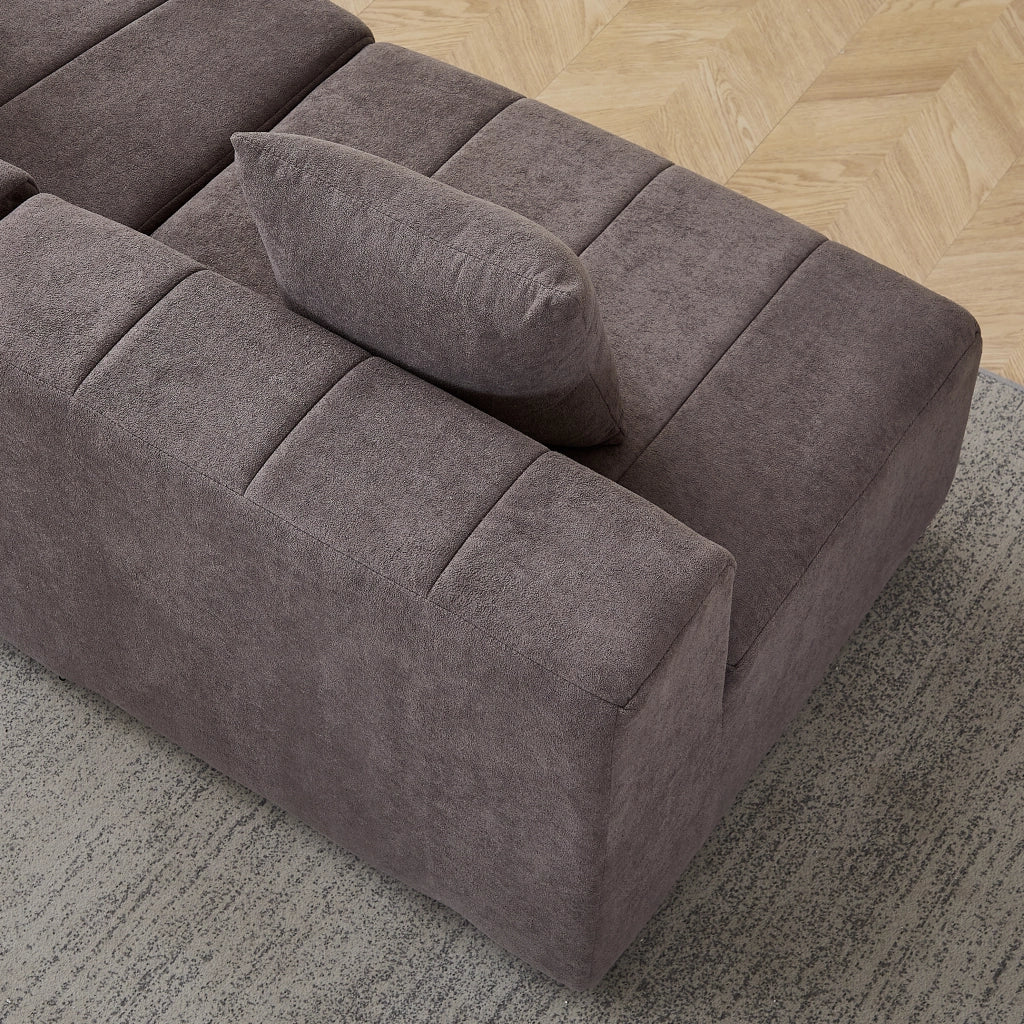 Modulo divano curvo in ciniglia grigio con 2 cuscini; design modulare