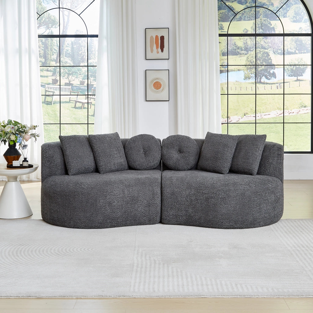 Divano modulare a 2 elementi curvo in chenille grigio con schienale continuo e 6 cuscini assortiti