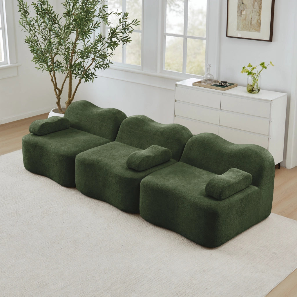 Divano angolare modulare senza struttura interna in velluto verde con seduta profonda e pouf collegabile ondulato