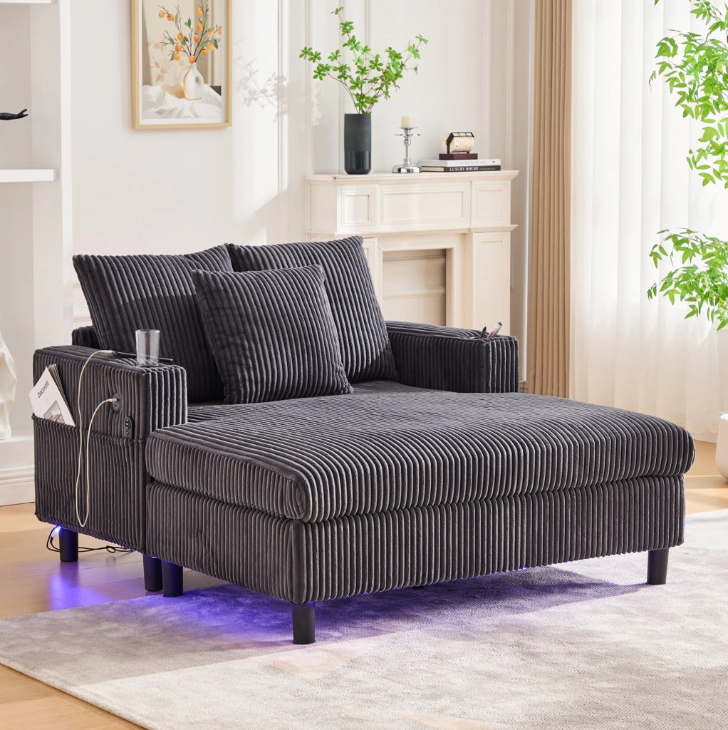 Poltrona relax ampia in velluto a coste grigio scuro con luci LED, porte USB e portabevande