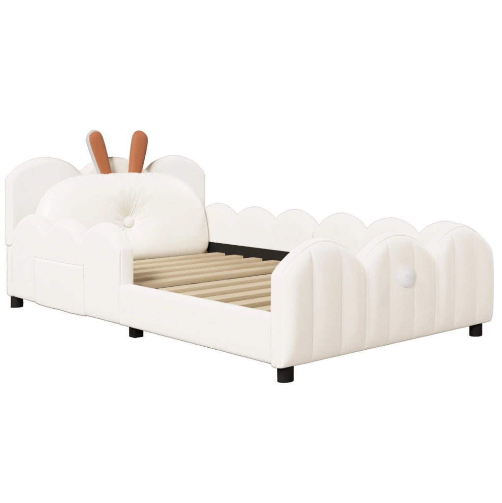 Letto piattaforma imbottito beige 90x200 cm con cuscino a forma di coniglio