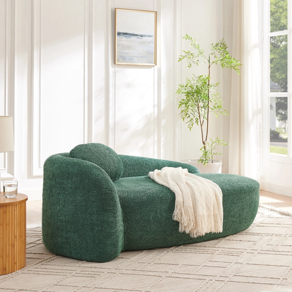Divano compatto dal design arrotondato in tessuto teddy verde con poggiatesta