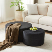 Set di 2 tavolini rotondi imbottiti in tessuto nero, utilizzabili come pouf