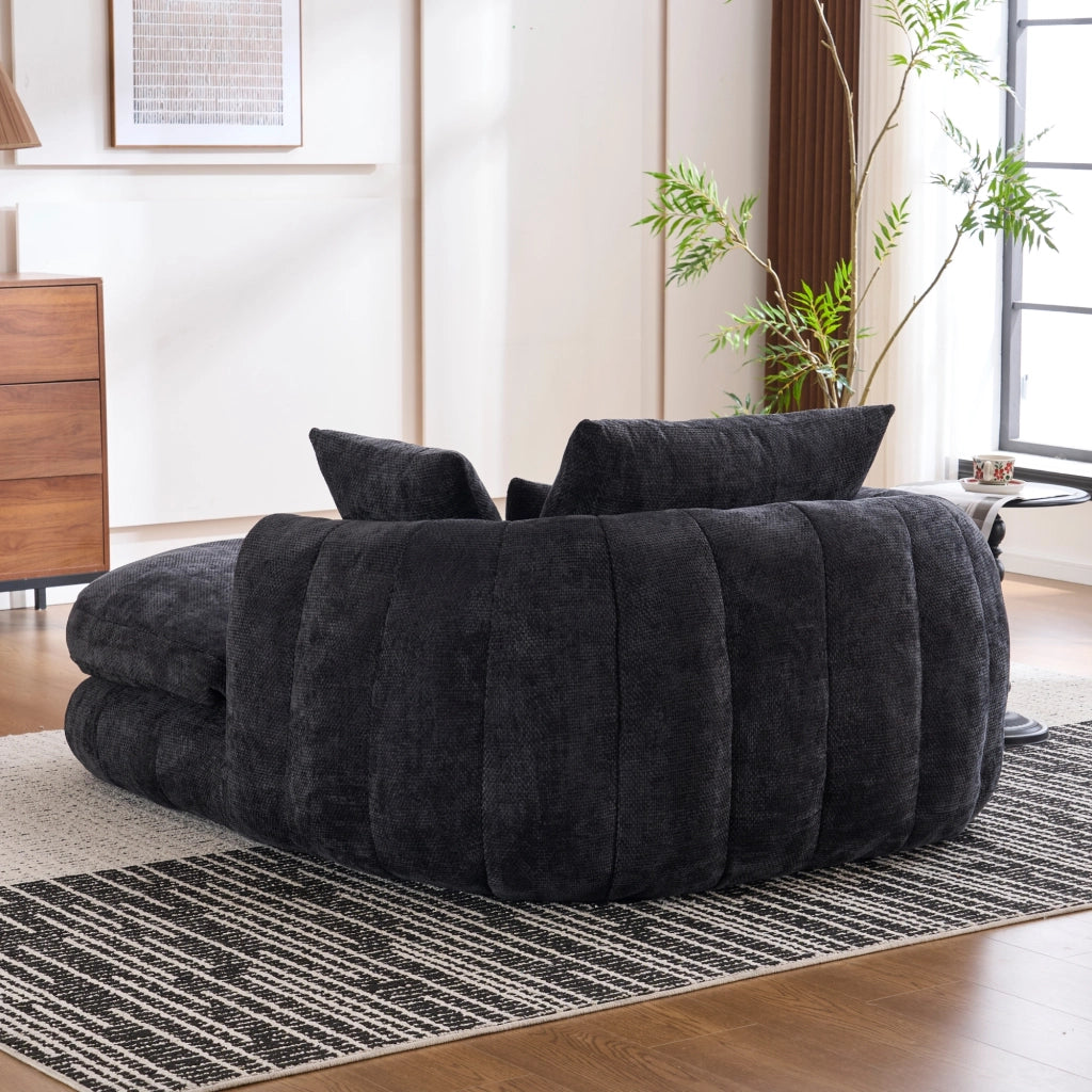 Poltrona chaise longue da interno con seduta profonda e cuscini, in chenille nera