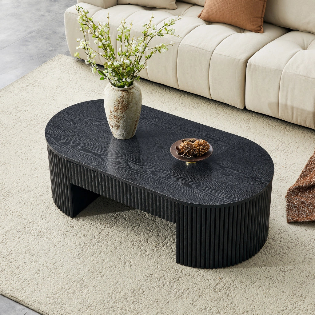 Tavolino basso fisso ovale con cassetto estraibile; rivestimento scanalato effetto legno nero in MDF per soggiorno