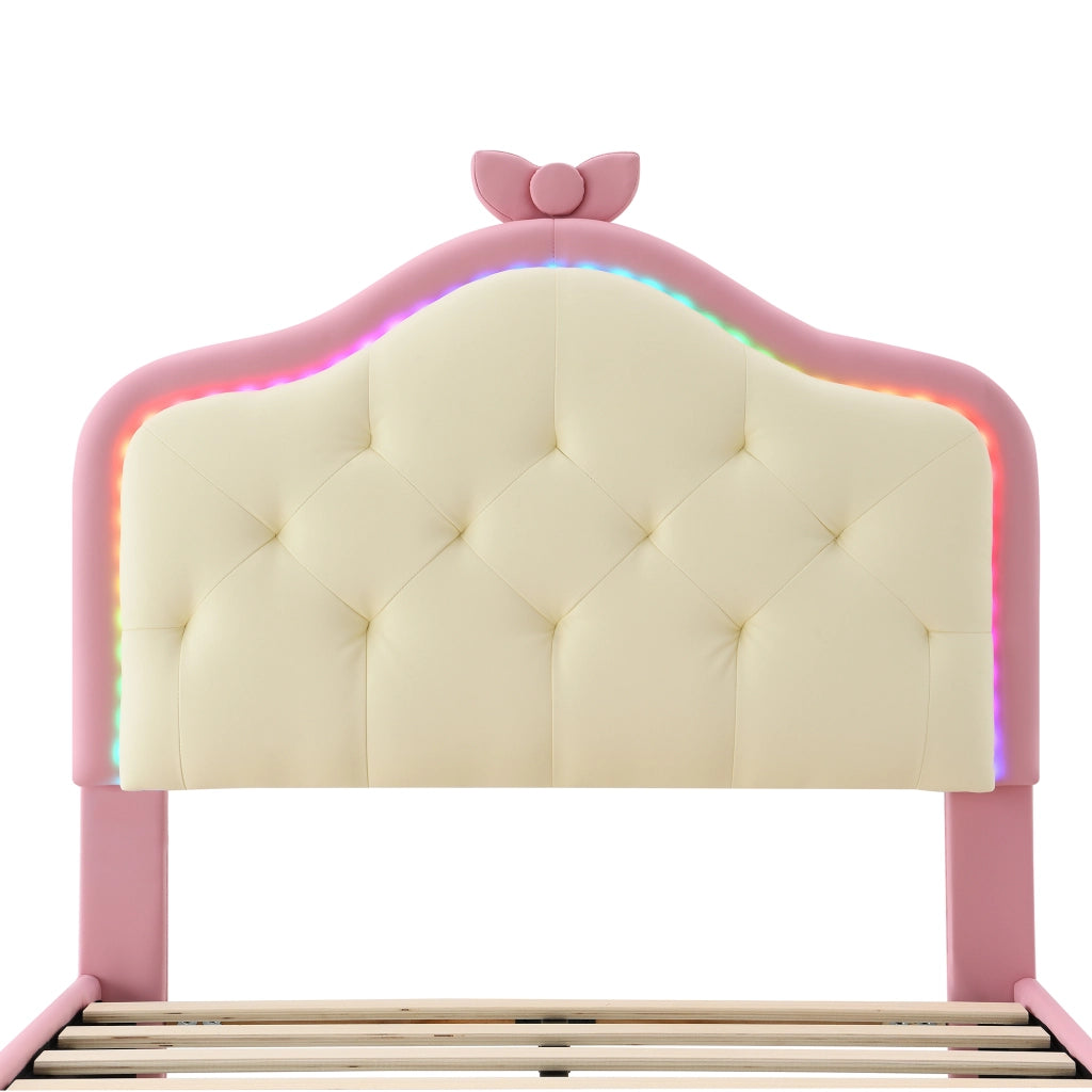 Letto singolo 90 × 200 cm con testiera imbottita LED multicolore fiocco rosa rete a doghe PU rosa e bianco per cameretta